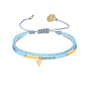 Braided bracelet with a playful gold plated heart charm