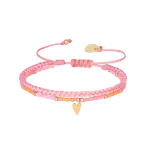 Braided bracelet with a playful gold plated heart charm
