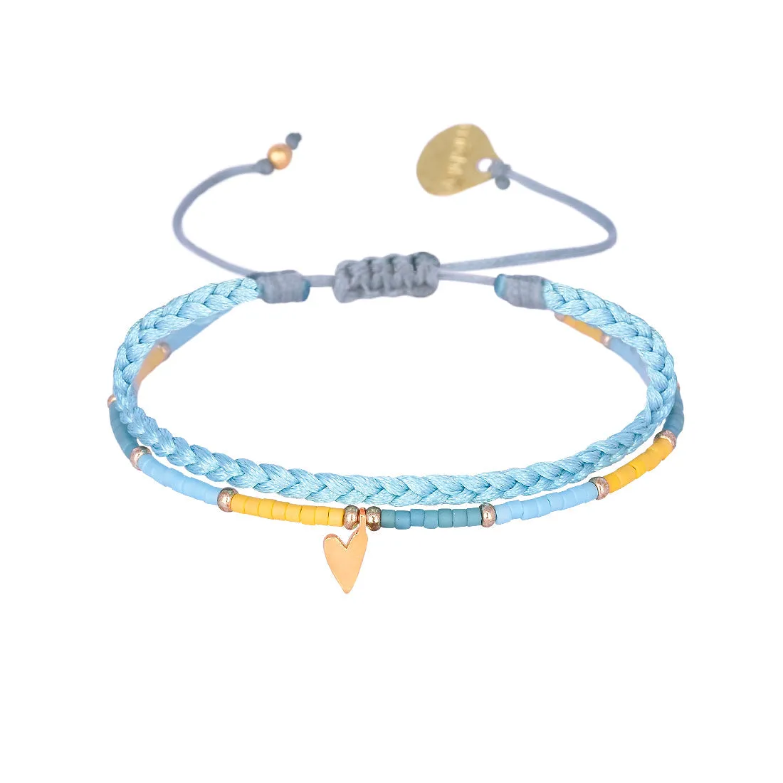 Braided bracelet with a playful gold plated heart charm