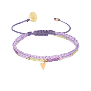 Braided bracelet with a playful gold plated heart charm